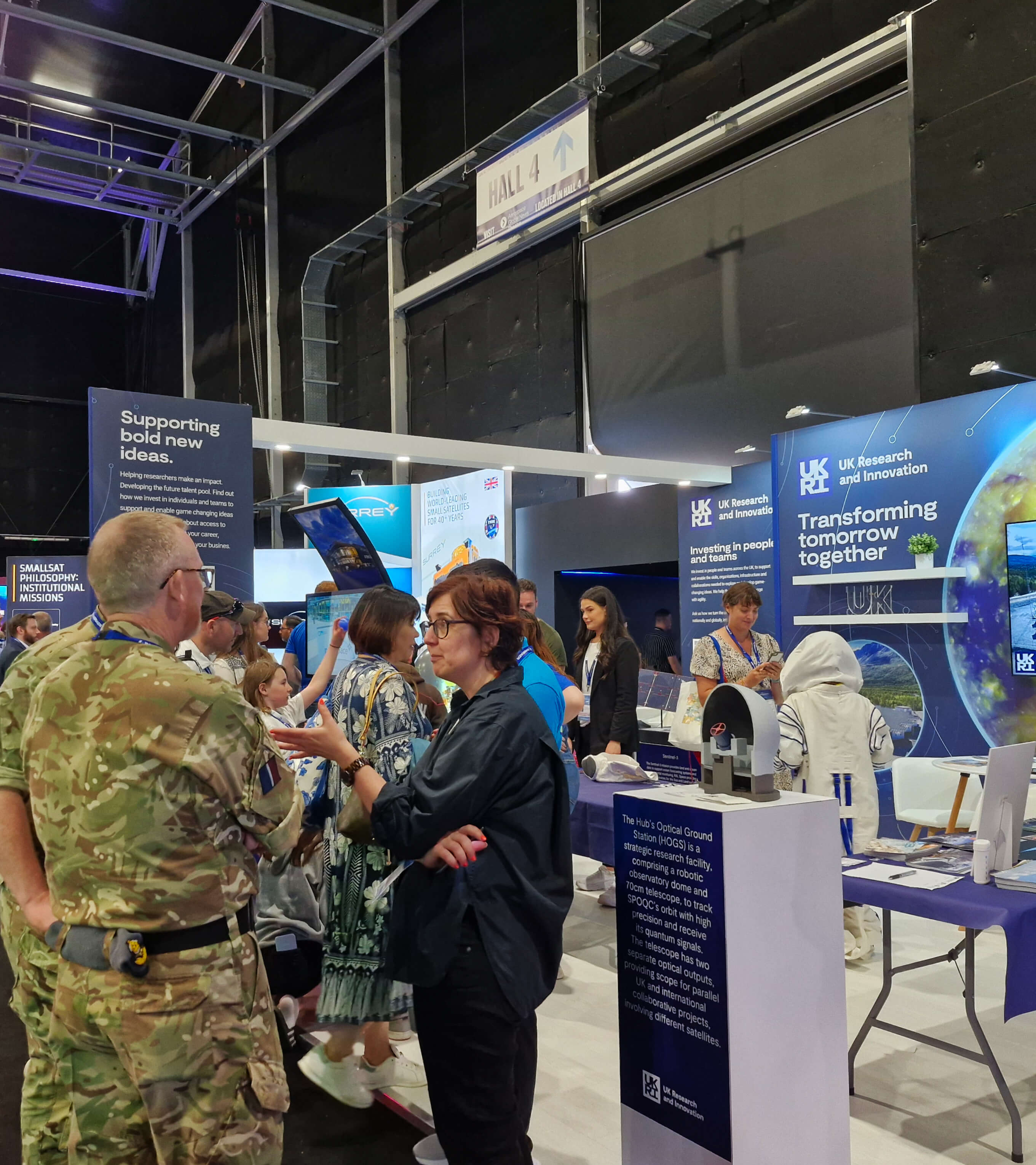 People looking at the exhibition stand